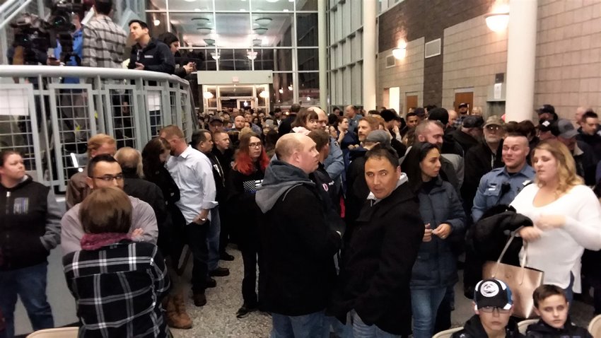 More than 250 gathered in the lobby of the Adams County Sheriff’s Department Commerce City substation to honor slain Deputy Heath Gumm on the anniversary of his death.
